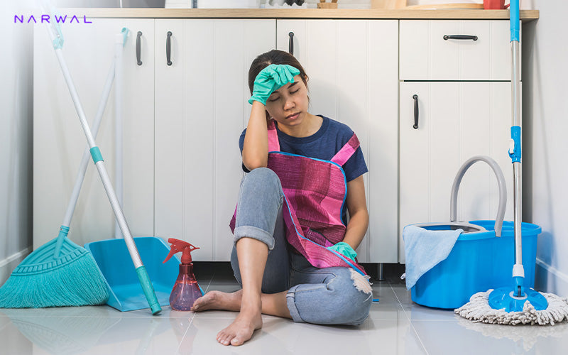 Tired woman cleaning, before using a Narwal robot